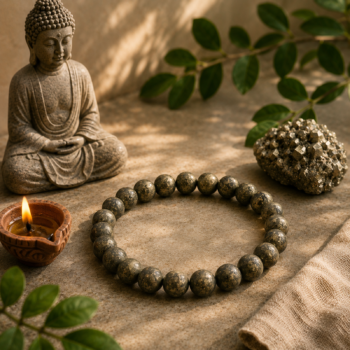 8mm Pyrite Crystal Bracelet with Buddha statue, diya and natural Pyrite on an earthy background