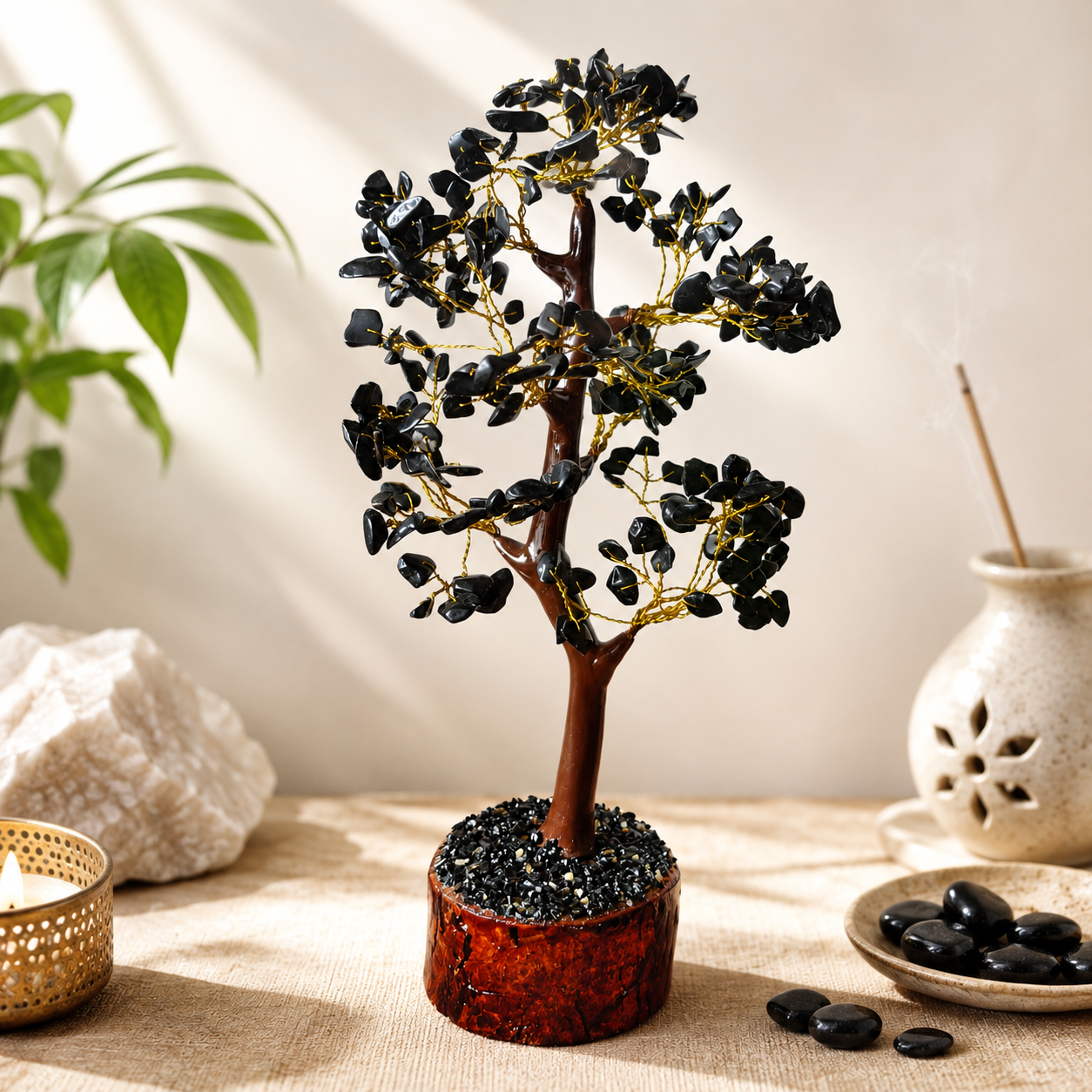 Black Tourmaline crystal tree with gold wire branches on a warm neutral background
