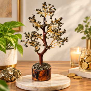 Pyrite crystal tree with golden wire branches displayed with raw pyrite and gold coins