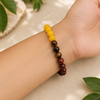 Woman wearing the Sinh Rashi (Leo) Bracelet made with Citrine, Tiger Eye and Sunstone 8 mm natural gemstone beads on the wrist.