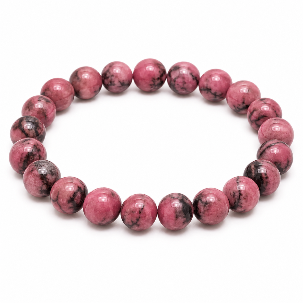 Natural Rhodonite crystal bracelet for balancing Heart Chakra (Anahata) with polished round pink gemstone beads arranged in a circular shape on a clean white background.